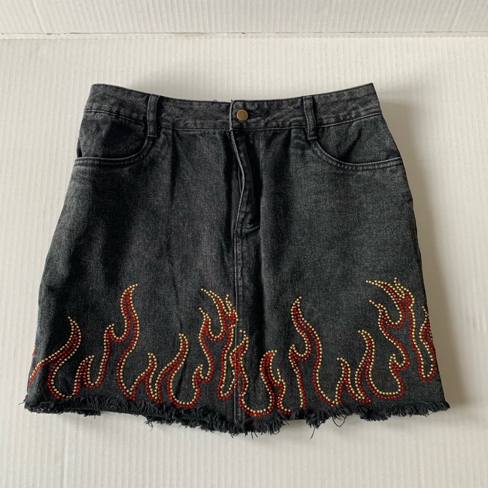 Black jean skirt with studded flames